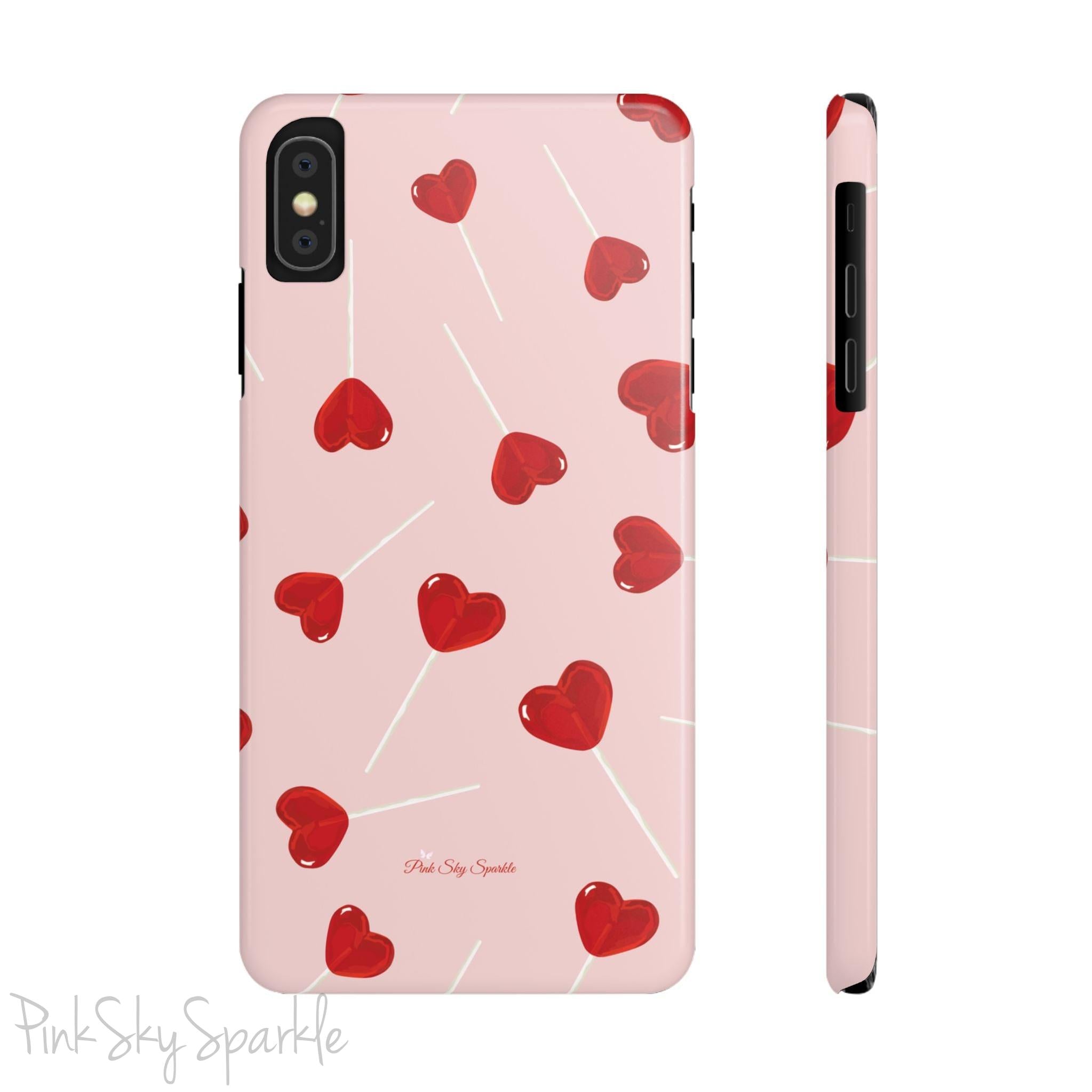 Pink phone case with red heart-shaped lollipop designs, perfect for Valentine’s Day or a playful aesthetic.