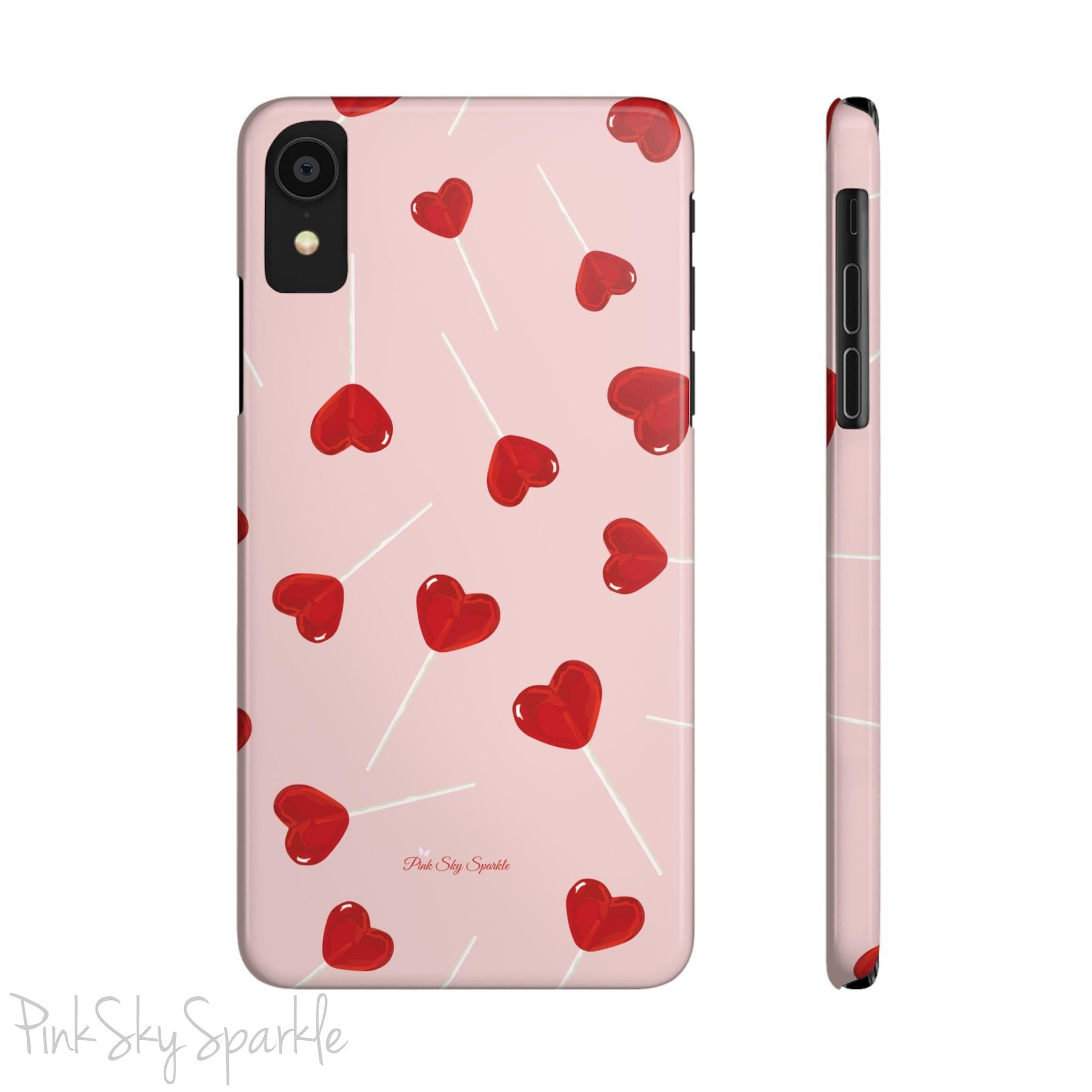 Pink phone case with red heart-shaped lollipop designs, perfect for Valentine’s Day or a playful aesthetic.
