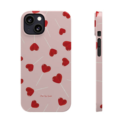 Pink phone case with red heart-shaped lollipop designs, perfect for Valentine’s Day or a playful aesthetic.