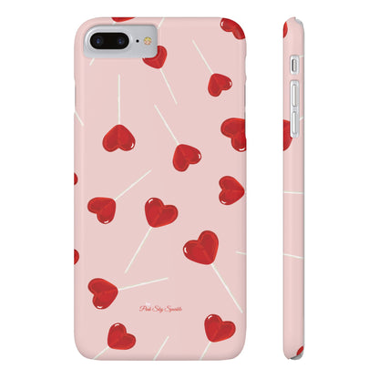 Pink phone case with red heart-shaped lollipop designs, perfect for Valentine’s Day or a playful aesthetic.