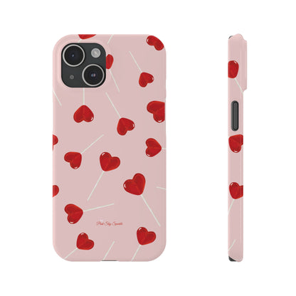 Pink phone case with red heart-shaped lollipop designs, perfect for Valentine’s Day or a playful aesthetic.