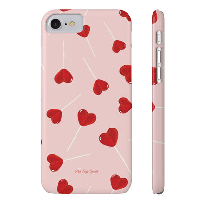 Pink phone case with red heart-shaped lollipop designs, perfect for Valentine’s Day or a playful aesthetic.