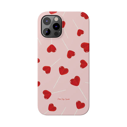 Pink phone case with red heart-shaped lollipop designs, perfect for Valentine’s Day or a playful aesthetic.