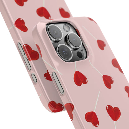 Pink phone case with red heart-shaped lollipop designs, perfect for Valentine’s Day or a playful aesthetic.