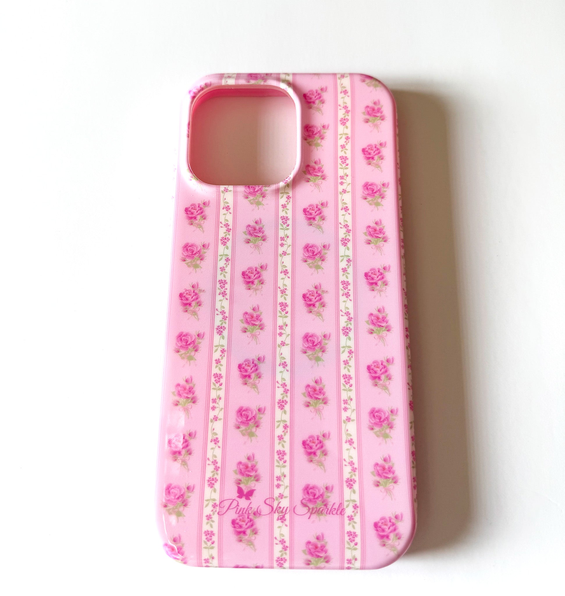 Pink floral phone case on a white background