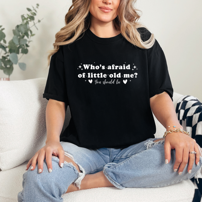 Black Comfort Colors Brand T-shirt with Taylor Swift inspired lyrics Who's afraid of little old me? You should be in white font.