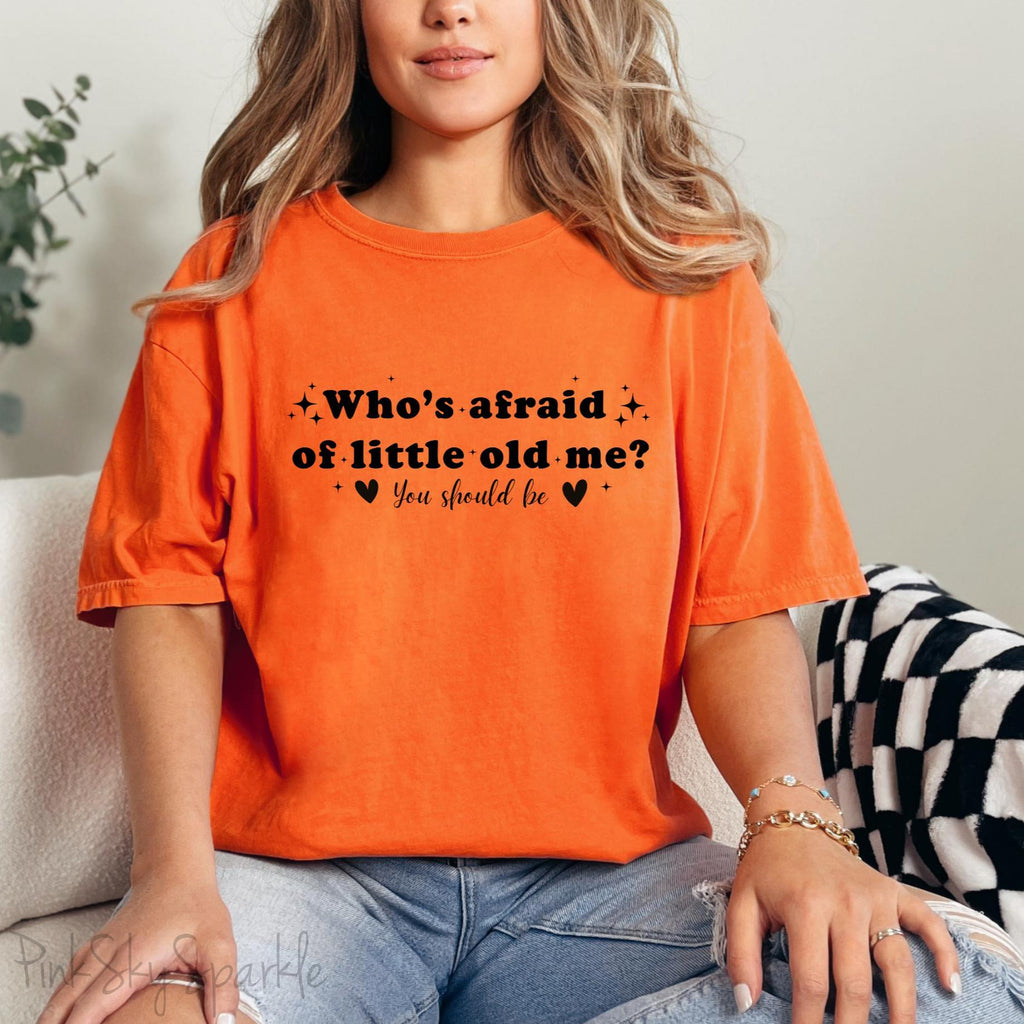 Burnt Orange Comfort Colors Brand T-shirt with Taylor Swift inspired lyrics Who's afraid of little old me? You should be in black font.