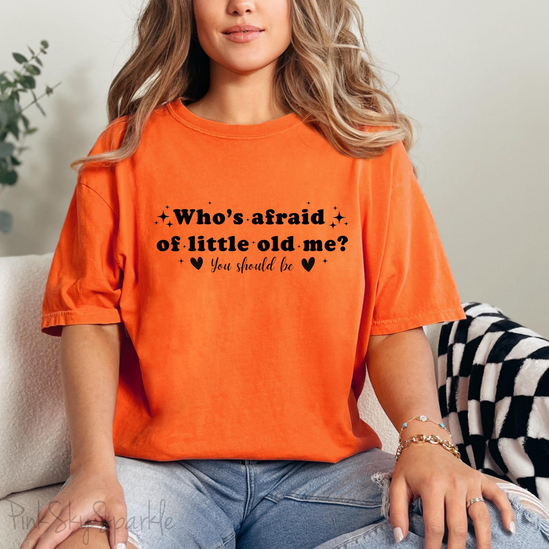 Burnt Orange Comfort Colors Brand T-shirt with Taylor Swift inspired lyrics Who's afraid of little old me? You should be in black font.