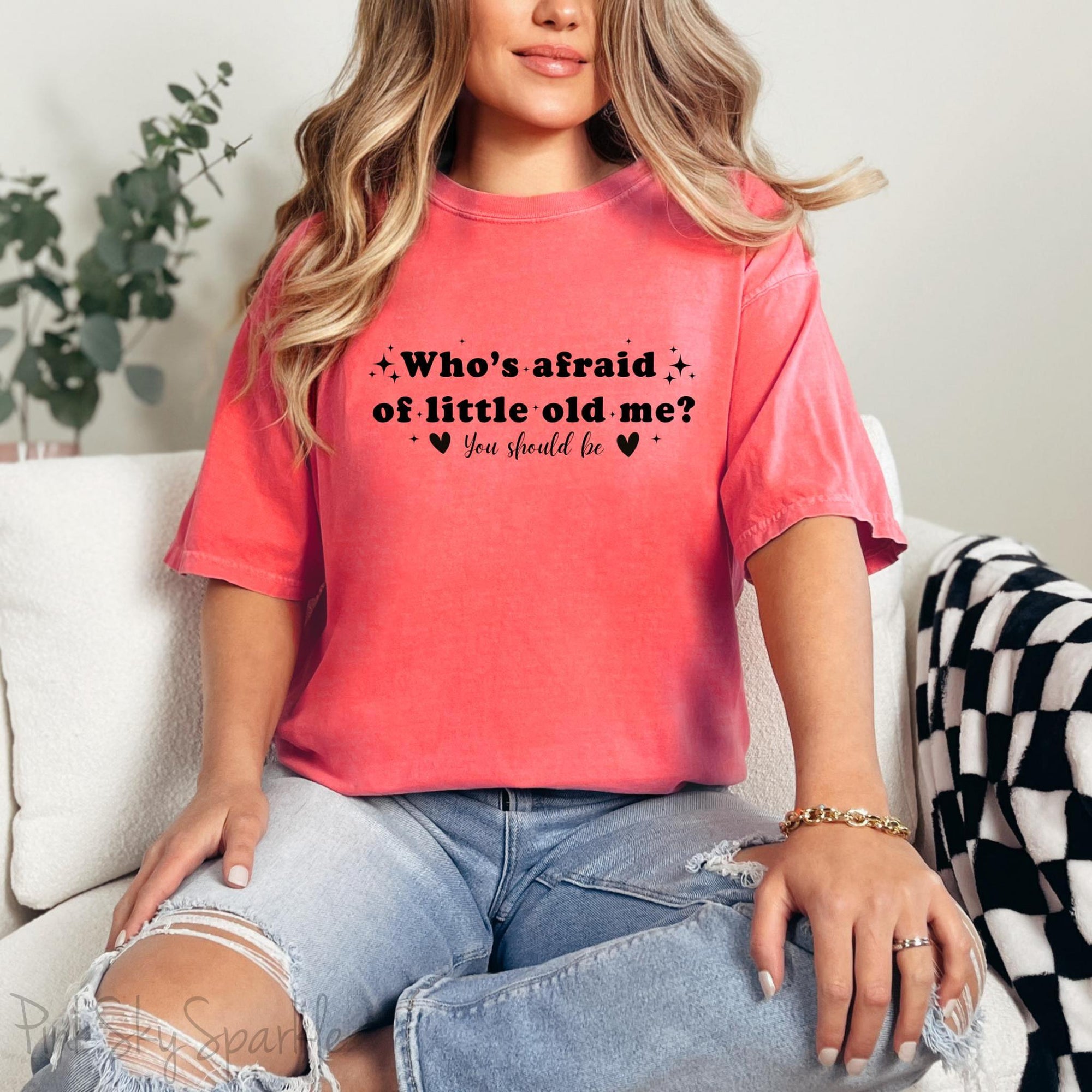Watermelon color Comfort Colors Brand T-shirt with Taylor Swift inspired lyrics Who's afraid of little old me? You should be in black font.