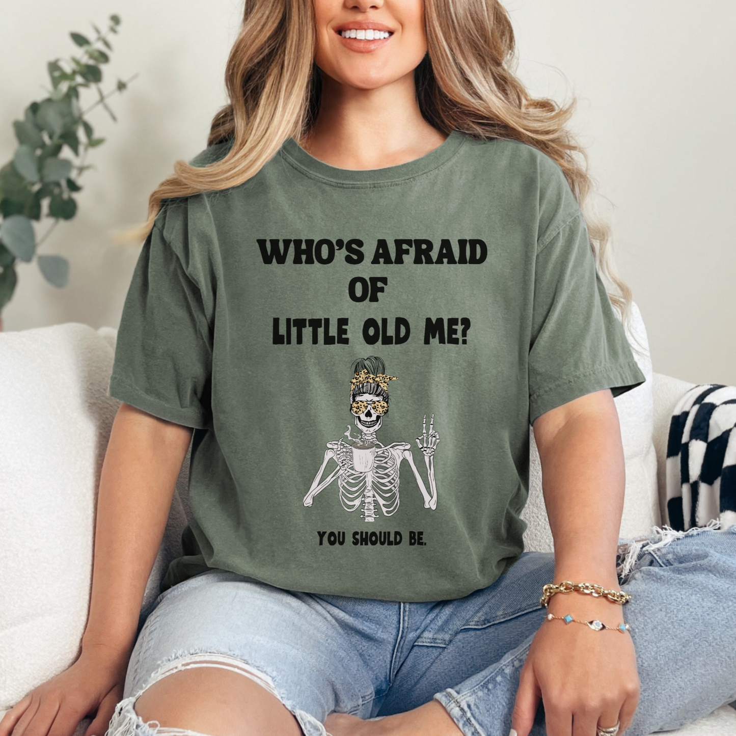 Moss green colored t-shirt - Who's Afraid of Little Old Me? You Should be. Skeleton drinking coffee and making peace sign design. 