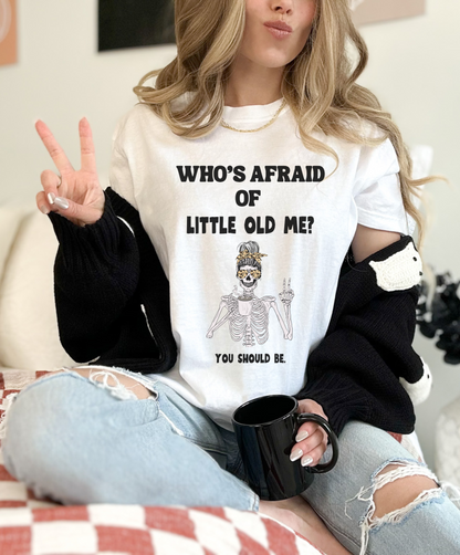 White colored t-shirt - Who's Afraid of Little Old Me? You Should be. Skeleton drinking coffee and making peace sign design. 