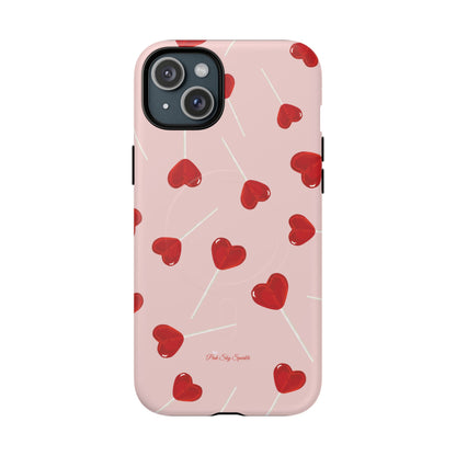 Pink phone case with red heart-shaped lollipop designs, perfect for Valentine’s Day or a playful aesthetic.