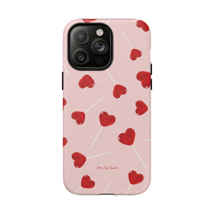 Pink phone case with red heart-shaped lollipop designs, perfect for Valentine’s Day or a playful aesthetic.