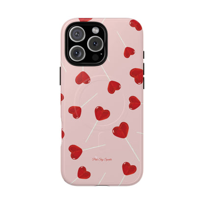 Pink phone case with red heart-shaped lollipop designs, perfect for Valentine’s Day or a playful aesthetic.