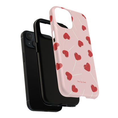 Pink phone case with red heart-shaped lollipop designs, perfect for Valentine’s Day or a playful aesthetic.