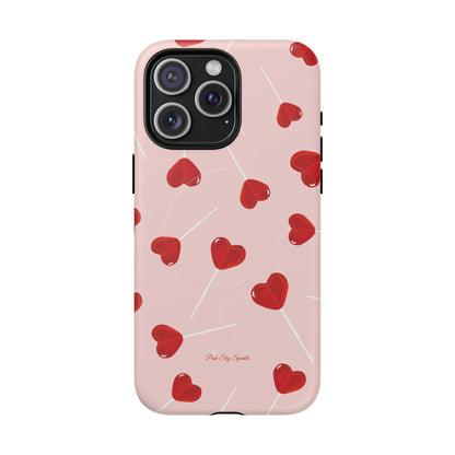 Pink phone case with red heart-shaped lollipop designs, perfect for Valentine’s Day or a playful aesthetic.